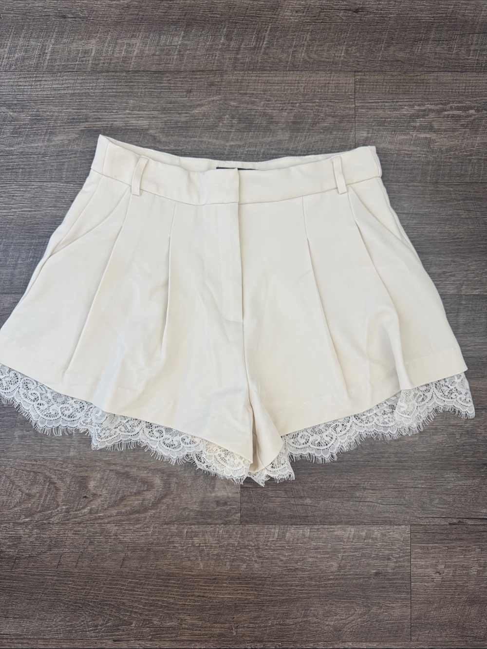 Lulu's Cream Lace-Hem Pleated Shorts